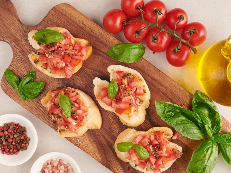 tasty savory tomato italian appetizers bruschetta slices toasted baguette garnished with basil vegetables herbs grilled toasted crusty ciabatta bread